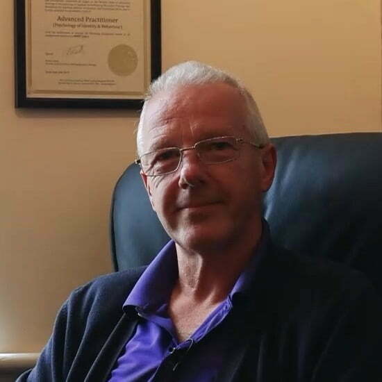 head and shoulder image of smiling, relaxed Mindset therapist Trevor Collins